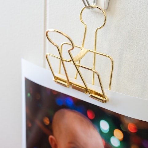 Gold clip for displaying prints.