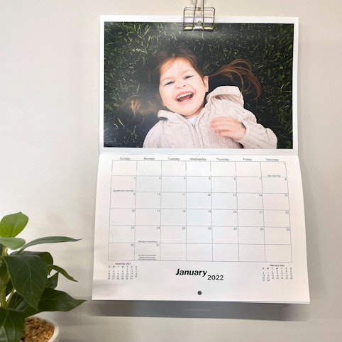 Personalise your wall calendar with 12 favourite photos. 