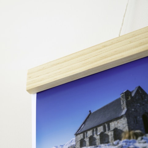 Wooden hangers are an alternative to framing.